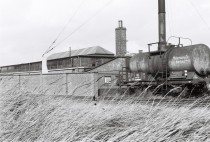 company-owned railroad-tank car in front of the warehouse